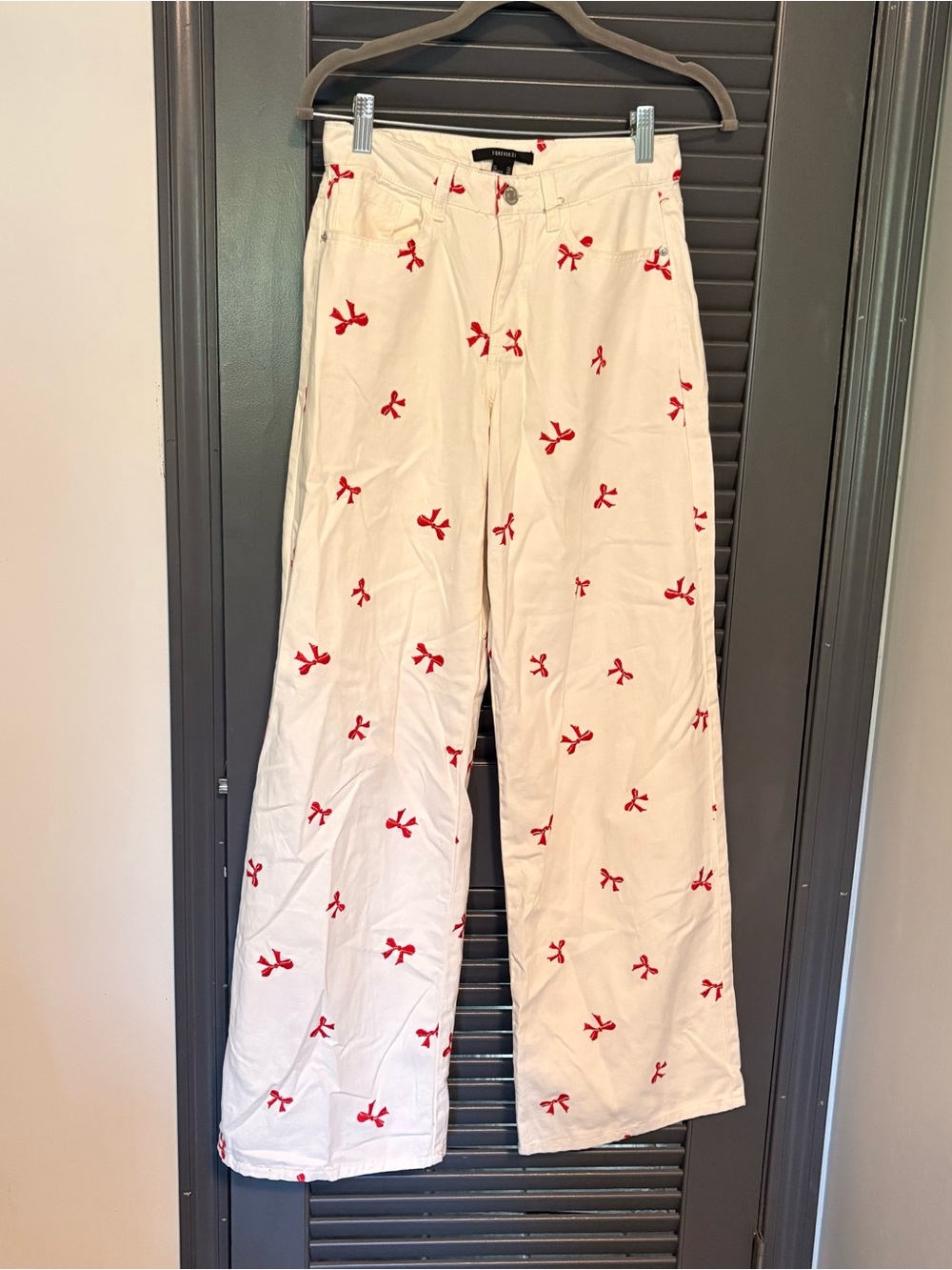 Forever 21 White Wide Leg Jeans with Red Bow Stitch Accents